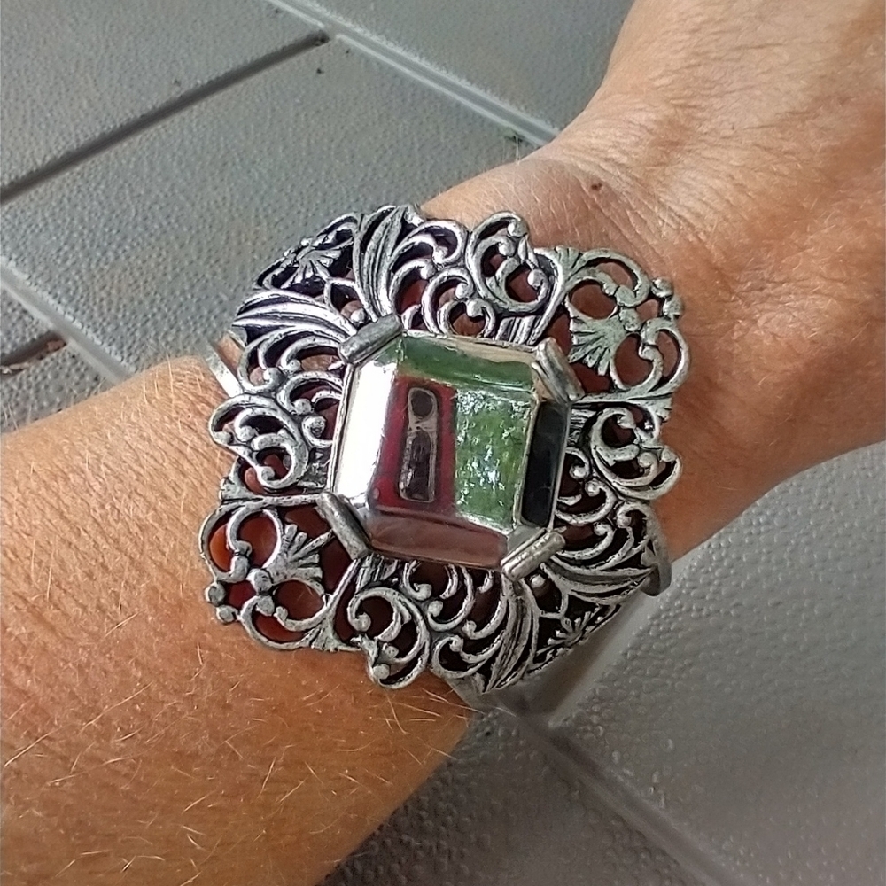 Women's large silver tone cuff bracelet.